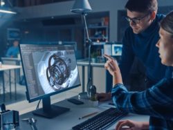 Engineers working with CAD CAM